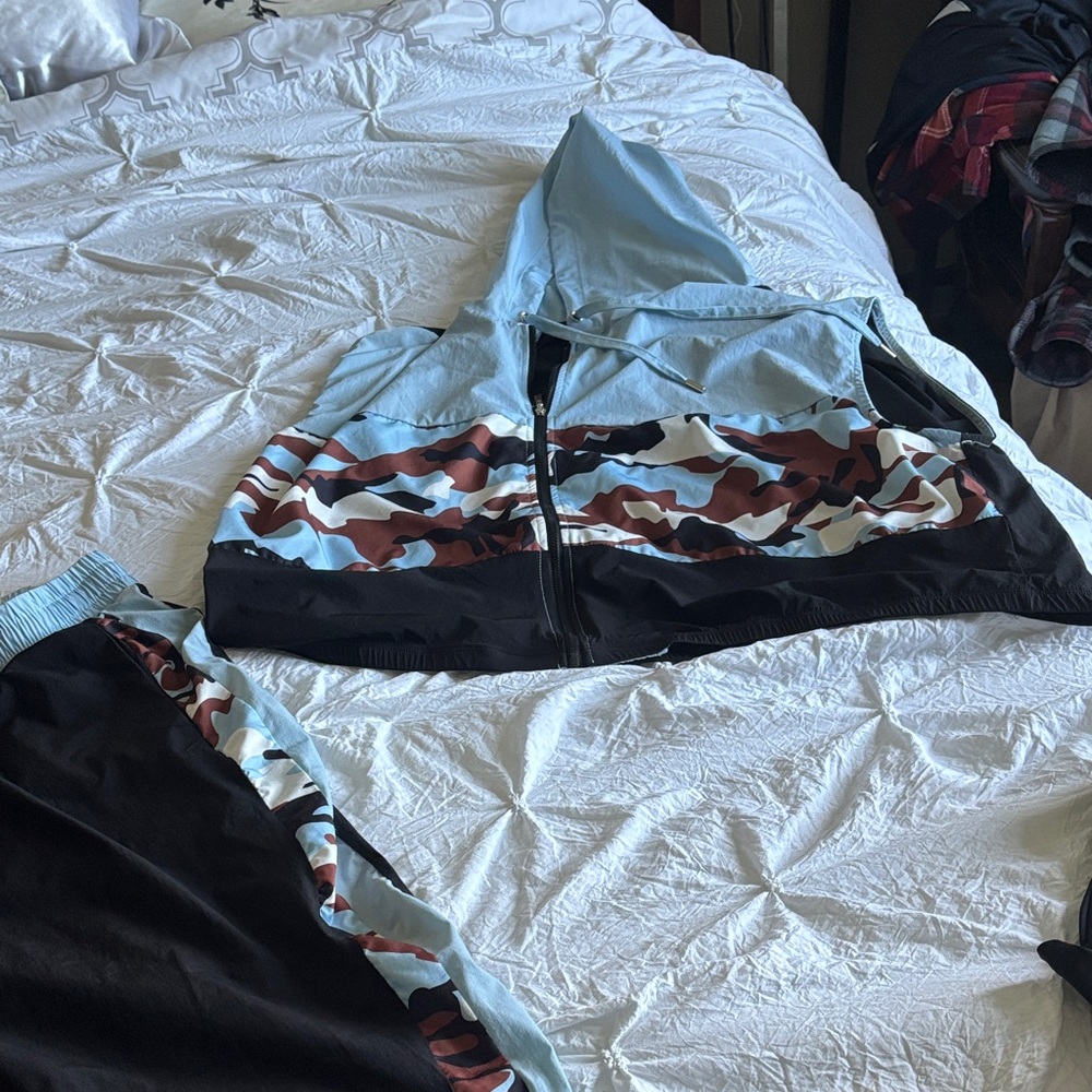 2 piece Ashley Stewart Black and Blue Capris with Camo Accent and vest with hood